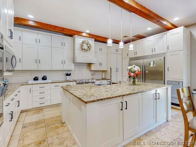 17716 S 39th W Ave, Mounds, OK 74047 - kitchen featuring appliances with stainless steel finishes, a sink, beam ceiling, tasteful backsplash, and custom range hood