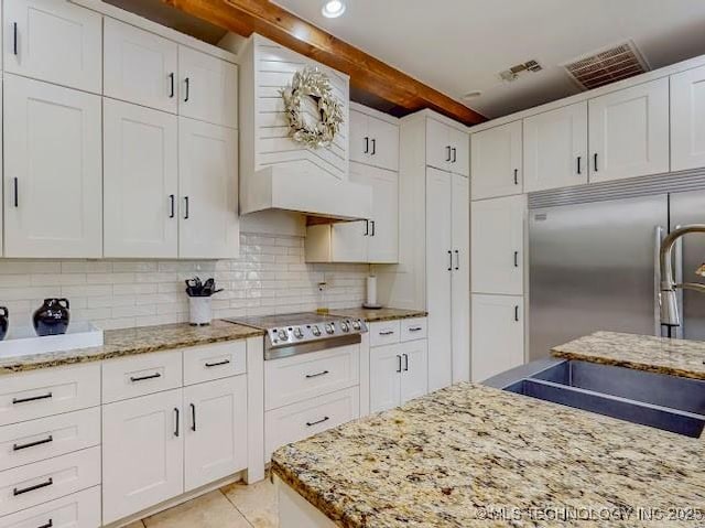 17716 S 39th W Ave, Mounds, OK 74047 - kitchen with appliances with stainless steel finishes, beam ceiling, white cabinets, and tasteful backsplash