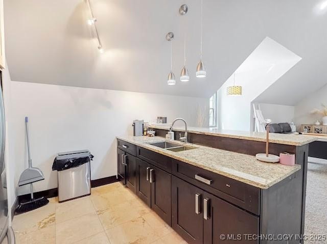 17716 S 39th W Ave, Mounds, OK 74047 - kitchen with lofted ceiling, a sink, a peninsula, pendant lighting, and dark brown cabinets