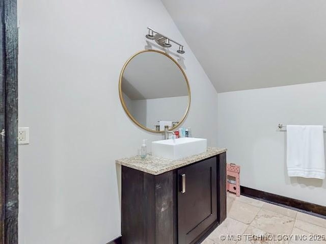 17716 S 39th W Ave, Mounds, OK 74047 - bathroom featuring lofted ceiling, vanity, and baseboards