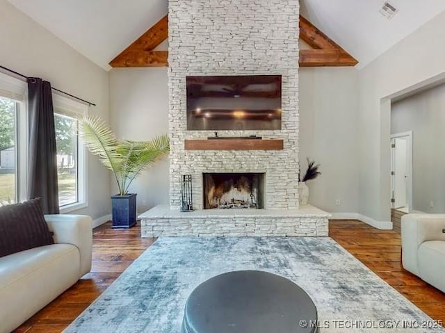 17716 S 39th W Ave, Mounds, OK 74047 - living room featuring high vaulted ceiling, a stone fireplace, wood finished floors, and baseboards