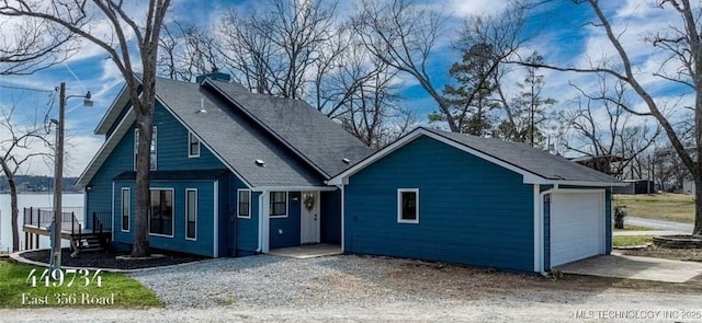 449734 E 356th Rd, Afton, OK 74331 - view of front of house with a shingled roof, driveway, and a garage
