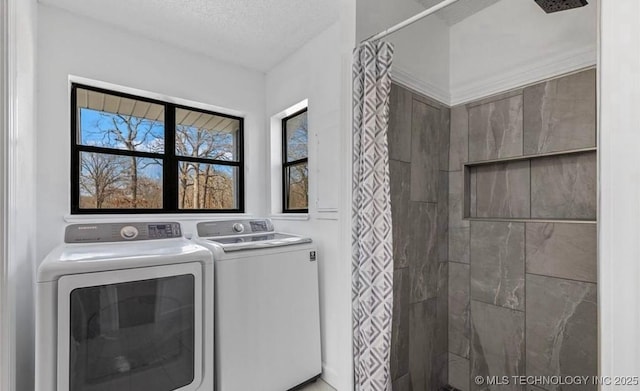 449734 E 356th Rd, Afton, OK 74331 - washroom with washing machine and clothes dryer and a textured ceiling