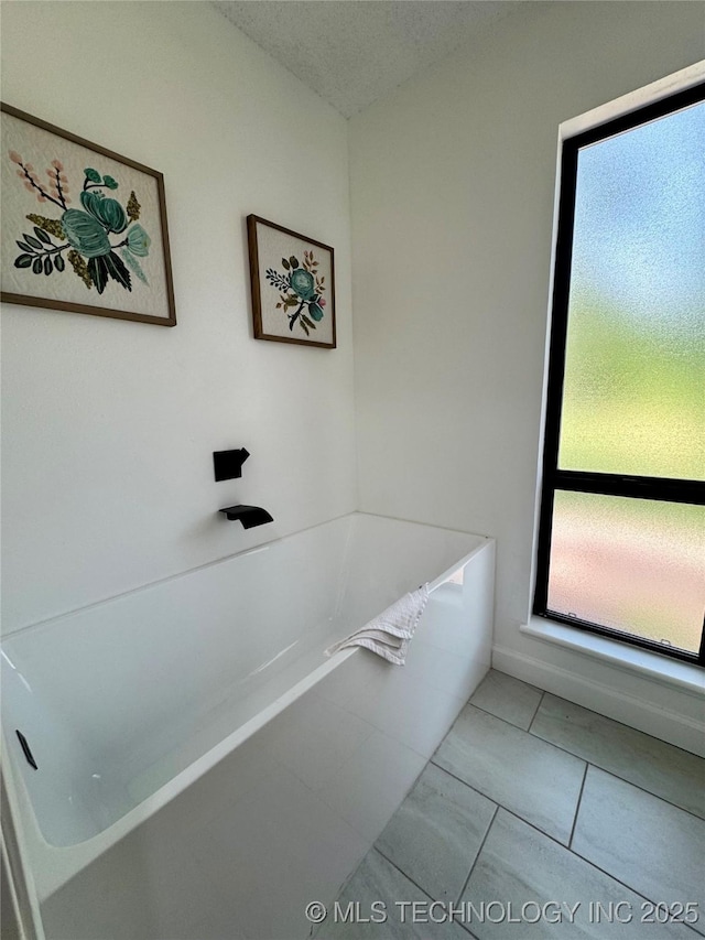 449734 E 356th Rd, Afton, OK 74331 - bathroom with a bathtub and tile patterned flooring
