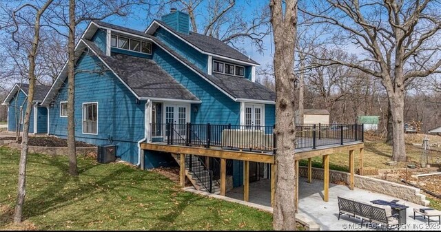449734 E 356th Rd, Afton, OK 74331 - back of property featuring a deck, a carport, a chimney, stairs, and a patio