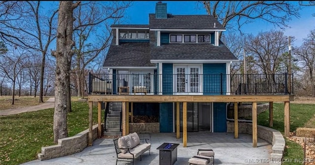 449734 E 356th Rd, Afton, OK 74331 - back of property with an outdoor fire pit, french doors, a patio, and a wooden deck