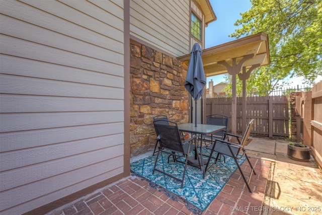 6353 S 80th E Ave Unit 1A, Tulsa, OK 74133 - view of patio / terrace featuring outdoor dining space