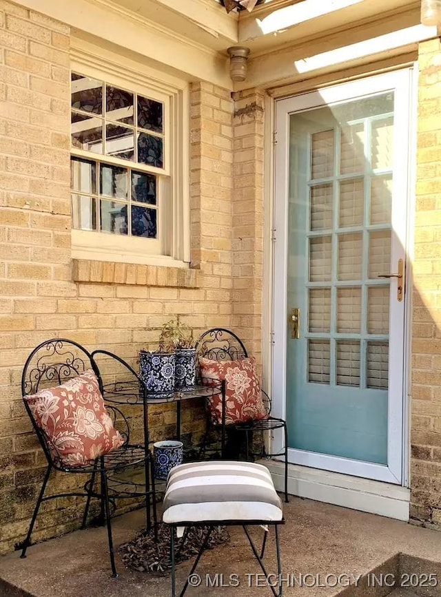 1124 W Elm, Durant, OK 74701 - doorway to property featuring brick siding