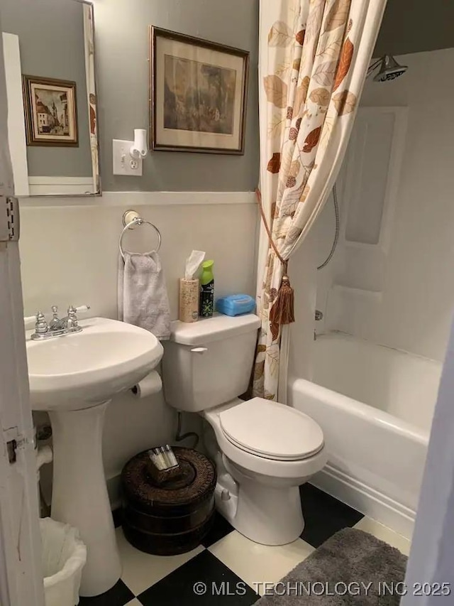 1124 W Elm, Durant, OK 74701 - full bath featuring toilet and shower / bath combo with shower curtain