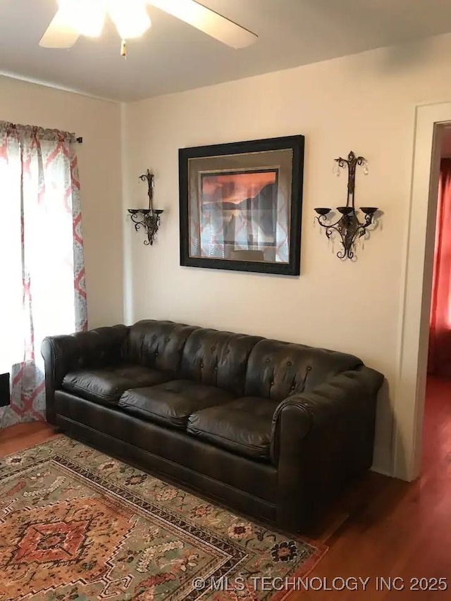 1124 W Elm, Durant, OK 74701 - living area with wood finished floors and a ceiling fan
