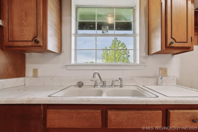 9590 S 4240th Rd, Chelsea, OK 74016 - kitchen featuring a sink, brown cabinets, and light countertops