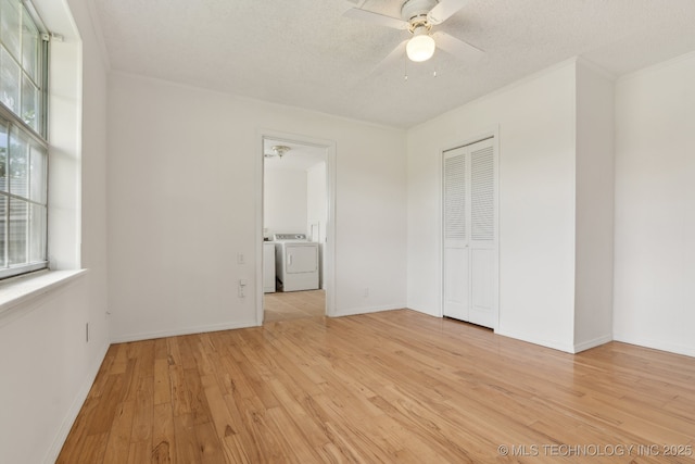 9590 S 4240th Rd, Chelsea, OK 74016 - empty room featuring washer / dryer, light wood-style flooring, a ceiling fan, plenty of natural light, and a textured ceiling