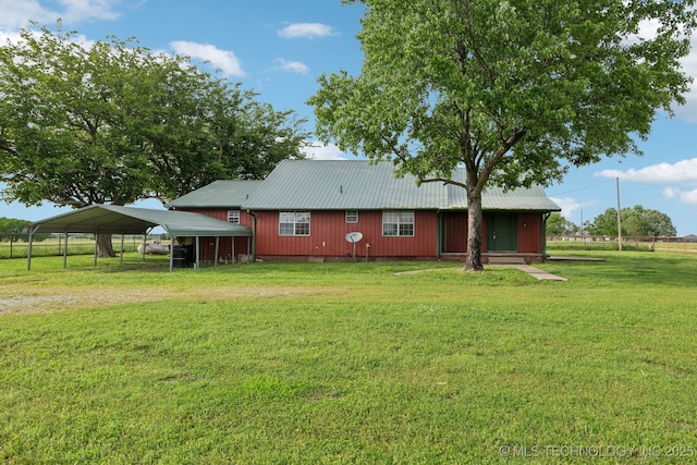 9590 S 4240th Rd, Chelsea, OK 74016 - rear view of house featuring a carport, metal roof, and dirt driveway