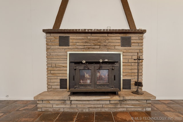 9590 S 4240th Rd, Chelsea, OK 74016 - detailed view of baseboards and a brick fireplace