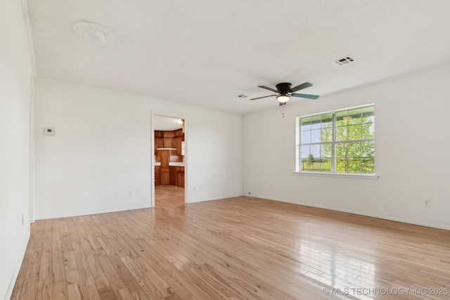 9590 S 4240th Rd, Chelsea, OK 74016 - empty room featuring light wood-style flooring, a ceiling fan, and baseboards