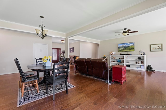 59144 E 290th Rd, Grove, OK 74344 - dining room featuring wood finished floors, a chandelier, crown molding, a ceiling fan, and baseboards