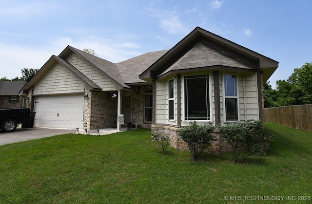 114 Stone, Roland, OK 74954 - view of front of house featuring an attached garage and driveway