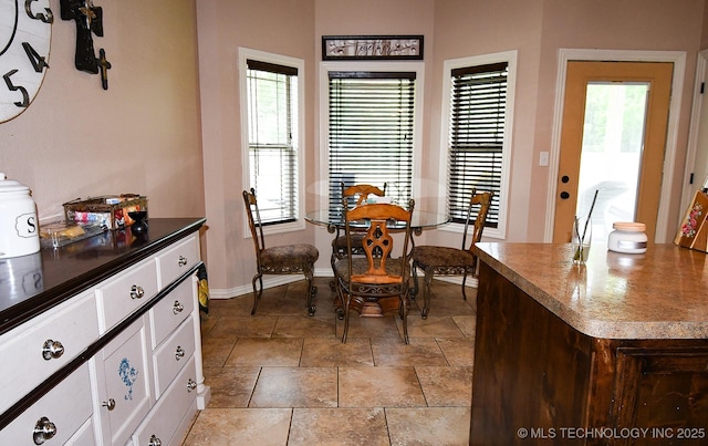 114 Stone, Roland, OK 74954 - dining room featuring baseboards and light stone finish floors