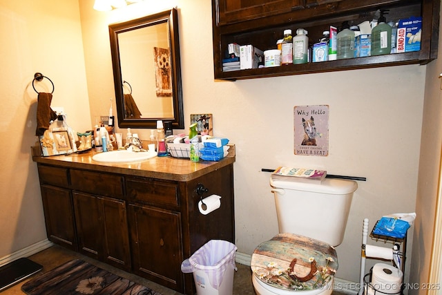 114 Stone, Roland, OK 74954 - half bath with vanity, baseboards, and toilet