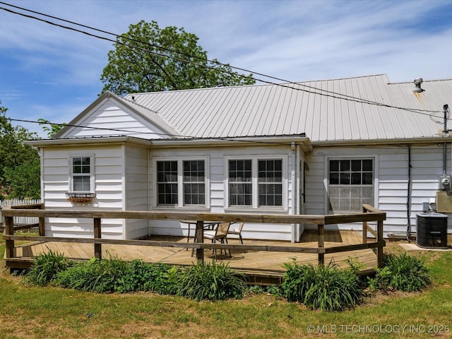1724 Cherokee Pl, Bartlesville, OK 74003 - rear view of property with a deck, metal roof, and central AC unit