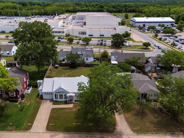 1724 Cherokee Pl, Bartlesville, OK 74003 - aerial perspective of suburban area featuring a heavily wooded area