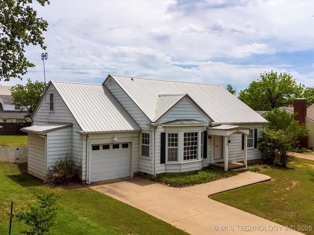 1724 Cherokee Pl, Bartlesville, OK 74003 - view of front of property featuring an attached garage, concrete driveway, and metal roof