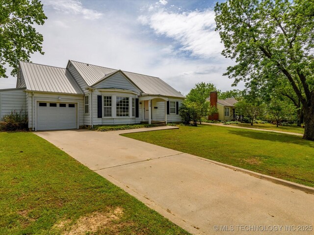 1724 Cherokee Pl, Bartlesville, OK 74003 - ranch-style house featuring a garage, driveway, a front yard, and metal roof