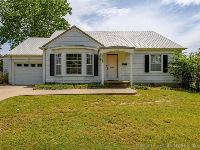 1724 Cherokee Pl, Bartlesville, OK 74003 - view of front facade featuring an attached garage, driveway, metal roof, and a front lawn