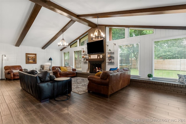 11837 S 84th Ave E, Bixby, OK 74008 - living area with a chandelier, a brick fireplace, dark wood-style flooring, and plenty of natural light
