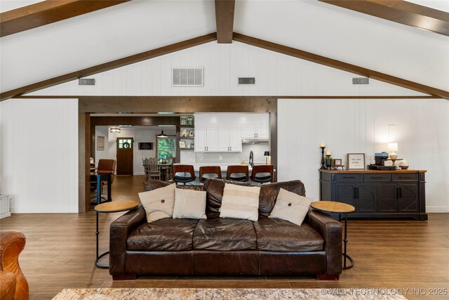11837 S 84th Ave E, Bixby, OK 74008 - living room featuring wood finished floors, wooden walls, and baseboards