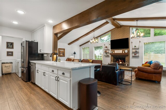 11837 S 84th Ave E, Bixby, OK 74008 - kitchen with a chandelier, open floor plan, white cabinets, and dark wood-style floors