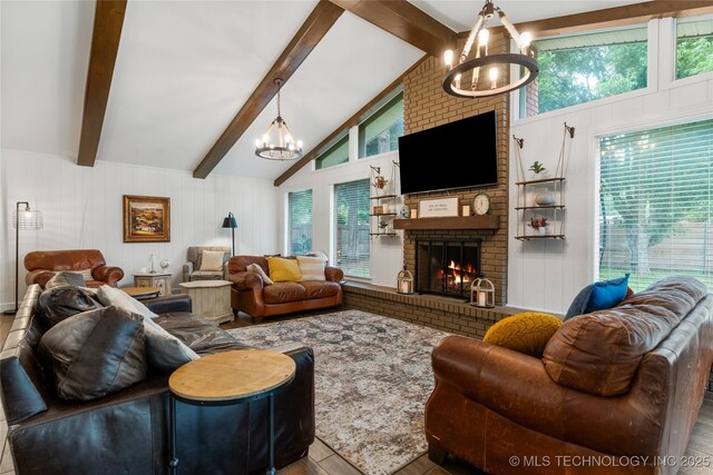 11837 S 84th Ave E, Bixby, OK 74008 - living area with a chandelier, wood finished floors, healthy amount of natural light, a brick fireplace, and a decorative wall