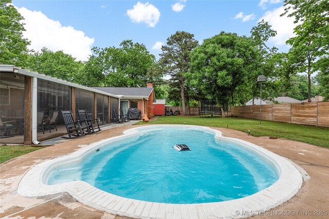 11837 S 84th Ave E, Bixby, OK 74008 - view of swimming pool featuring a trampoline, a patio, and a sunroom