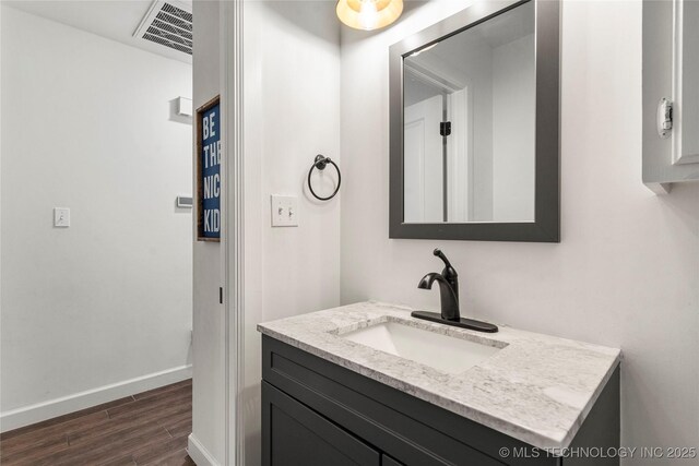 11837 S 84th Ave E, Bixby, OK 74008 - bathroom featuring wood finished floors, baseboards, and vanity