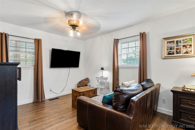 11837 S 84th Ave E, Bixby, OK 74008 - living area with wood finished floors, ceiling fan, and baseboards