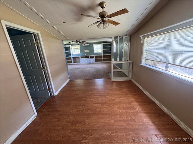 31206 E 683rd St, Wagoner, OK 74467 - hall with wood finished floors, vaulted ceiling, and baseboards