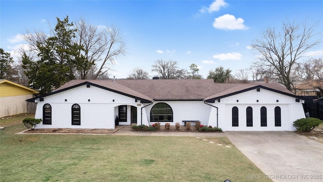 2014 12th Ave NW, Ardmore, OK 73401 - ranch-style home featuring concrete driveway, a front yard, brick siding, and roof with shingles