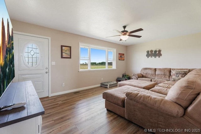 24708 E 18th Rd, Vinita, OK 74301 - living room with ceiling fan, baseboards, and wood finished floors