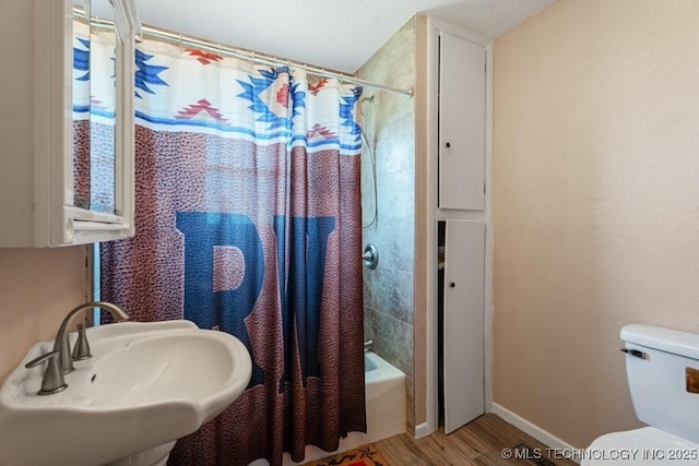 24708 E 18th Rd, Vinita, OK 74301 - full bath with a sink, wood finished floors, toilet, baseboards, and shower / bath combination with curtain