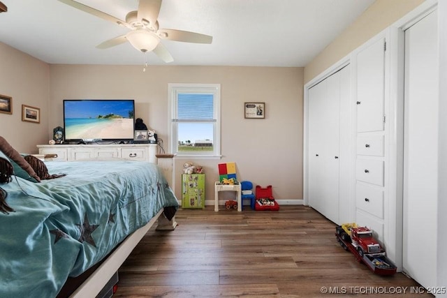 24708 E 18th Rd, Vinita, OK 74301 - bedroom with wood finished floors, a closet, baseboards, and a ceiling fan