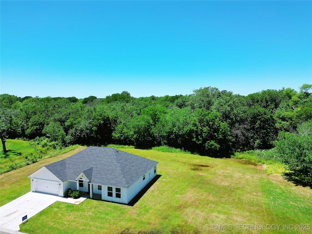345 Kats, Durant, OK 74701 - aerial view of property and surrounding area with a heavily wooded area