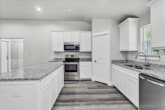 345 Kats, Durant, OK 74701 - kitchen with stainless steel appliances, a sink, dark wood finished floors, white cabinetry, and recessed lighting