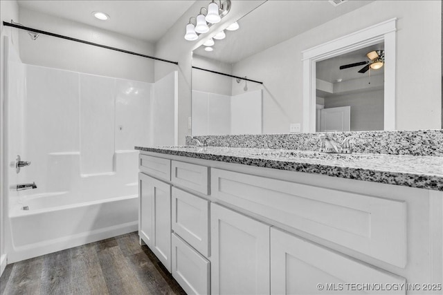 345 Kats, Durant, OK 74701 - bathroom featuring wood finished floors, tub / shower combination, recessed lighting, and double vanity