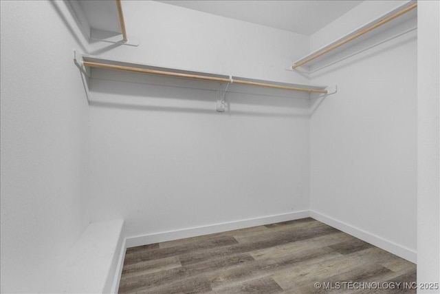 345 Kats, Durant, OK 74701 - walk in closet featuring wood finished floors