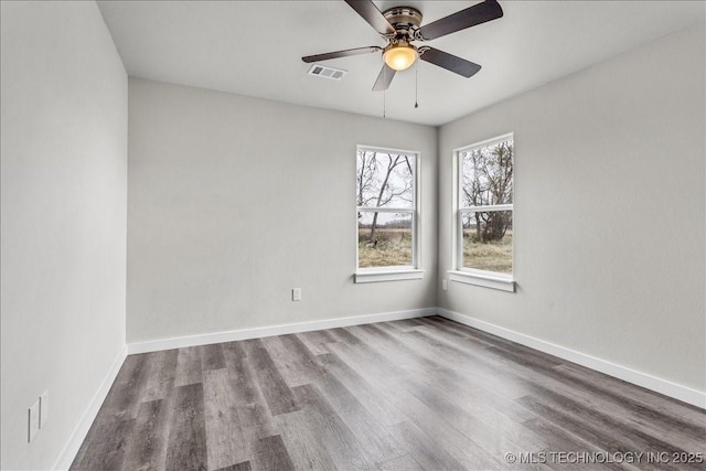 345 Kats, Durant, OK 74701 - spare room with wood finished floors, baseboards, and a ceiling fan