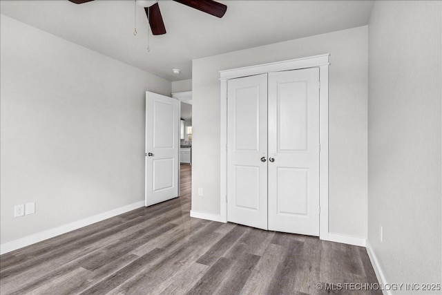 345 Kats, Durant, OK 74701 - unfurnished bedroom with wood finished floors, baseboards, a closet, and a ceiling fan