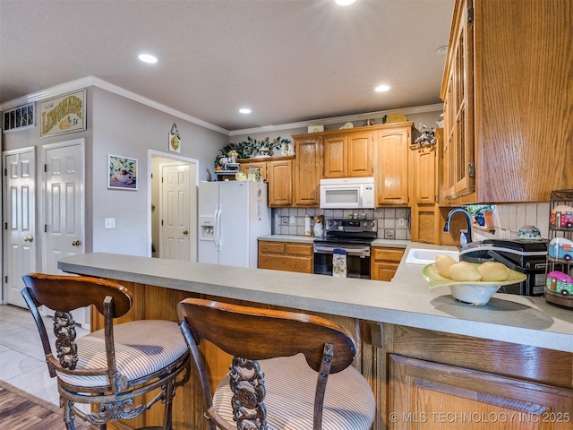 1821 N 11th St, Broken Arrow, OK 74012 - kitchen featuring white appliances, a sink, ornamental molding, a kitchen bar, and light countertops