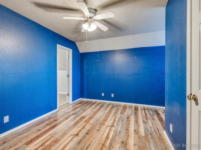 1821 N 11th St, Broken Arrow, OK 74012 - spare room featuring a ceiling fan, wood finished floors, a textured ceiling, and baseboards