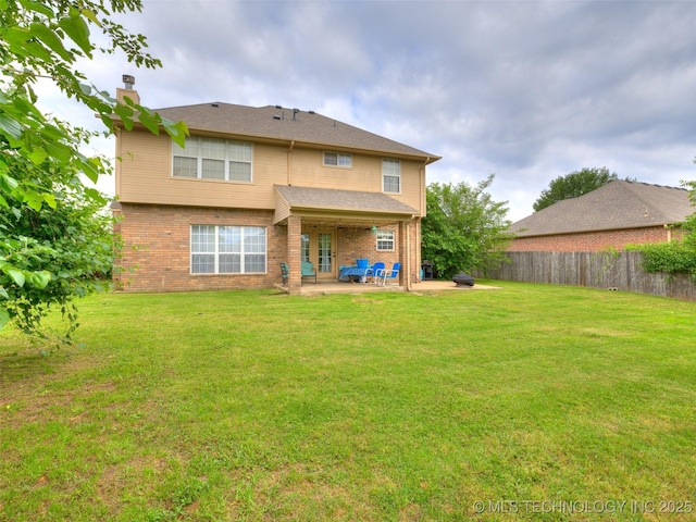 1821 N 11th St, Broken Arrow, OK 74012 - rear view of property featuring a patio area, a chimney, and brick siding