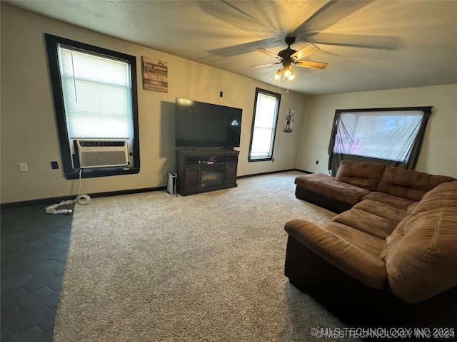 441 SE Carter St, Ardmore, OK 73401 - living room featuring a ceiling fan, cooling unit, and baseboards